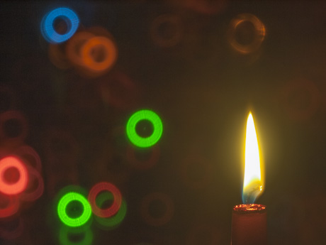 photo of candle and Christmas lights taken with mirror lens